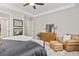 Large main bedroom with sitting area, dresser, and mirrors at 21893 E Tufts Cir, Aurora, CO 80015