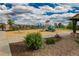 Fenced-in community playground with play structures, shade, and landscaping at 21893 E Tufts Cir, Aurora, CO 80015