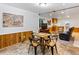 Finished basement area with tile floors, wood paneling, and seating at 1836 S Kendall Ct, Lakewood, CO 80232