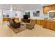 Finished basement area with tile floors, wood paneling, and a dry bar area at 1836 S Kendall Ct, Lakewood, CO 80232