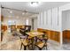 Finished basement with tile floors, wood paneling, and comfortable seating at 1836 S Kendall Ct, Lakewood, CO 80232