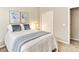 Comfortable bedroom featuring a full bed and an ensuite bathroom, creating a warm and inviting space at 1836 S Kendall Ct, Lakewood, CO 80232