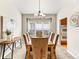 Traditional dining room with a wooden table and upholstered chairs in a neutral color palette at 1836 S Kendall Ct, Lakewood, CO 80232