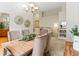 Elegant dining room features a large wooden table, modern lighting, and neutral paint palette at 1836 S Kendall Ct, Lakewood, CO 80232