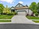 Beautifully landscaped single-Gathering home with a two-car garage and neutral siding at 1836 S Kendall Ct, Lakewood, CO 80232