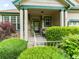Charming front porch with stone accents and lush landscaping at 1836 S Kendall Ct, Lakewood, CO 80232