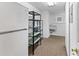 Walk-in pantry with plentiful shelving units to maximize storage, plus a sink at 1836 S Kendall Ct, Lakewood, CO 80232