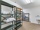 Spacious storage room with metal shelving and a utility sink at 1836 S Kendall Ct, Lakewood, CO 80232