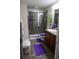 Well-lit bathroom featuring a glass-enclosed shower and vanity at 12714 Leyden St # C, Thornton, CO 80602