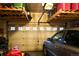 Organized two-car garage with overhead storage racks and ample space for vehicles and tools at 12714 Leyden St # C, Thornton, CO 80602