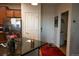 The modern kitchen includes a breakfast bar, stainless steel refrigerator, and dark countertops at 12714 Leyden St # C, Thornton, CO 80602