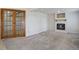 This basement space has a fireplace and wood French doors at 7036 Orion Ln, Arvada, CO 80007