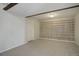 A basement space with an open book case at 7036 Orion Ln, Arvada, CO 80007