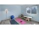 This bedroom features natural light and exercise area at 7036 Orion Ln, Arvada, CO 80007