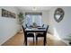 Bright dining room with a marble table and modern chandelier at 7036 Orion Ln, Arvada, CO 80007