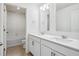 Bathroom featuring double sink vanity and shower over tub at 27554 E Byers Ave, Aurora, CO 80018