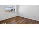 Inviting bedroom with laminate flooring, a bright window view and neutral walls at 27554 E Byers Ave, Aurora, CO 80018