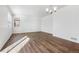 Spacious living room features wood floors and natural light from the adjacent windows at 27554 E Byers Ave, Aurora, CO 80018