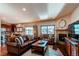 Spacious living room with a fireplace and leather furniture at 23760 Eagle Bend Ln, Parker, CO 80138