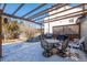 Backyard with a covered patio and outdoor dining set, perfect for entertaining at 10407 Strasburg Way, Parker, CO 80134