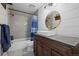 Updated bathroom featuring shiplap wall, modern finishes, and a new vanity at 10407 Strasburg Way, Parker, CO 80134