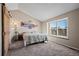Bedroom with natural light and large window seat at 10407 Strasburg Way, Parker, CO 80134