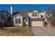 Charming two-story home featuring a well-maintained yard and attached two-car garage at 10407 Strasburg Way, Parker, CO 80134