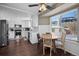 Kitchen featuring stainless steel appliances, white cabinets, and a breakfast nook at 10407 Strasburg Way, Parker, CO 80134