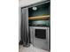 Laundry closet with updated washer and dryer, shelving, and storage space at 10407 Strasburg Way, Parker, CO 80134