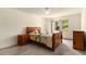 Cozy bedroom features neutral carpet, ceiling fan and lots of natural light for a relaxing atmosphere at 3144 S Wheeling Way # 106, Aurora, CO 80014