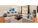 Bright living room with large sliding door, plush seating, modern decor and decorative area rug at 3144 S Wheeling Way # 106, Aurora, CO 80014