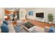 Cozy living space featuring hardwood floors that seamlessly flow into the kitchen at 3144 S Wheeling Way # 106, Aurora, CO 80014