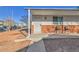 Welcoming front porch with seating and a secure, decorative screen door at 16608 E 13Th Ave, Aurora, CO 80011