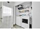 Convenient laundry room with modern washer and dryer; functional and well-lit space at 16608 E 13Th Ave, Aurora, CO 80011