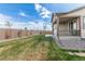 Large backyard featuring healthy green grass, sturdy fence, and privacy from neighboring homes at 27957 E 9Th Dr, Aurora, CO 80018