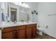 Elegant bathroom with a double sink vanity, ample lighting, and stylish décor for a luxurious feel at 27957 E 9Th Dr, Aurora, CO 80018