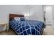 Comfortable bedroom with a large bed, soft lighting, and closet for convenience and storage at 27957 E 9Th Dr, Aurora, CO 80018
