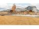 Sky Ranch community entrance sign featuring stone pillars and festive holiday wreaths at 27957 E 9Th Dr, Aurora, CO 80018