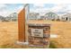 Big Dipper Park features a stone sign with native grasses in this residential community at 27957 E 9Th Dr, Aurora, CO 80018