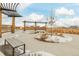 This neighborhood park is landscaped with seating, native grasses and a wood pergola at 27957 E 9Th Dr, Aurora, CO 80018