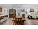 Bright dining room featuring a large wooden table with seating for six at 27957 E 9Th Dr, Aurora, CO 80018