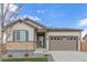 Charming single-Gathering home with a two-car garage, landscaped front yard, and inviting entryway at 27957 E 9Th Dr, Aurora, CO 80018