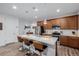 Modern kitchen with stainless steel appliances, a center island with bar seating, and ample cabinet space at 27957 E 9Th Dr, Aurora, CO 80018