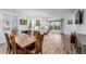 Bright living space features a dining area and comfortable recliners with sliding doors to a well-maintained outdoor area at 27957 E 9Th Dr, Aurora, CO 80018