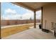 Covered back patio with yard and fence views at 27957 E 9Th Dr, Aurora, CO 80018