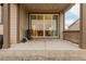 Covered patio with view into home and fenced-in backyard at 27957 E 9Th Dr, Aurora, CO 80018