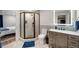 Modern basement bathroom with a walk-in shower and updated vanity at 9392 Anvil St, Arvada, CO 80007