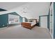 Spacious bedroom featuring a vaulted ceiling, a ceiling fan, neutral walls and a wood bed at 772 Garfield St, Denver, CO 80206