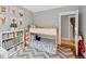 Charming bedroom featuring a bunk bed, playful animal artwork, and a colorful bookcase at 772 Garfield St, Denver, CO 80206