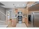 Well-equipped kitchen with stainless steel appliances, neutral cabinets and tiled floor at 772 Garfield St, Denver, CO 80206